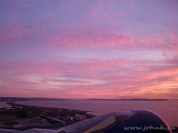 View from the plane taking off at sunset