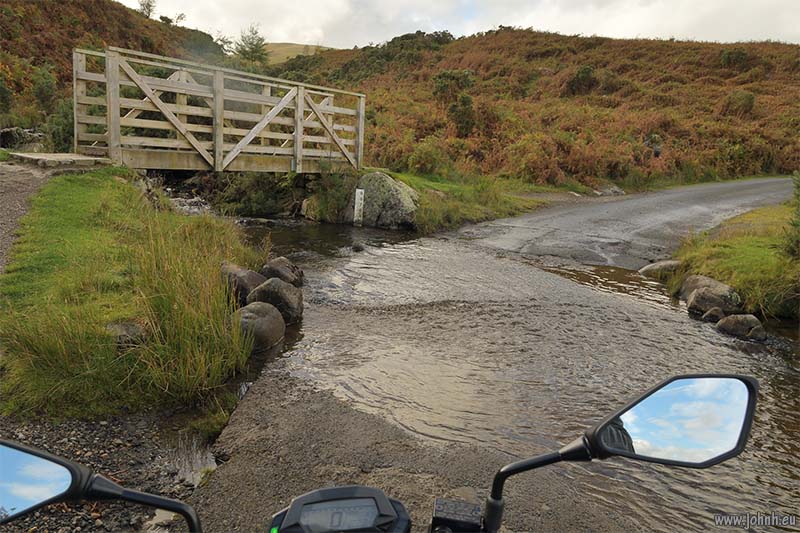 Splashing through puddles on Caldbeck Fell